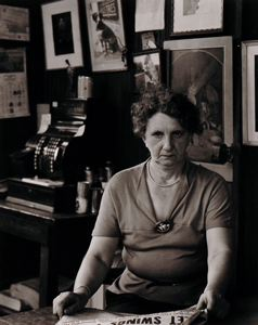Image of Untitled [Portrait of woman at newspaper stand, New York, NY]